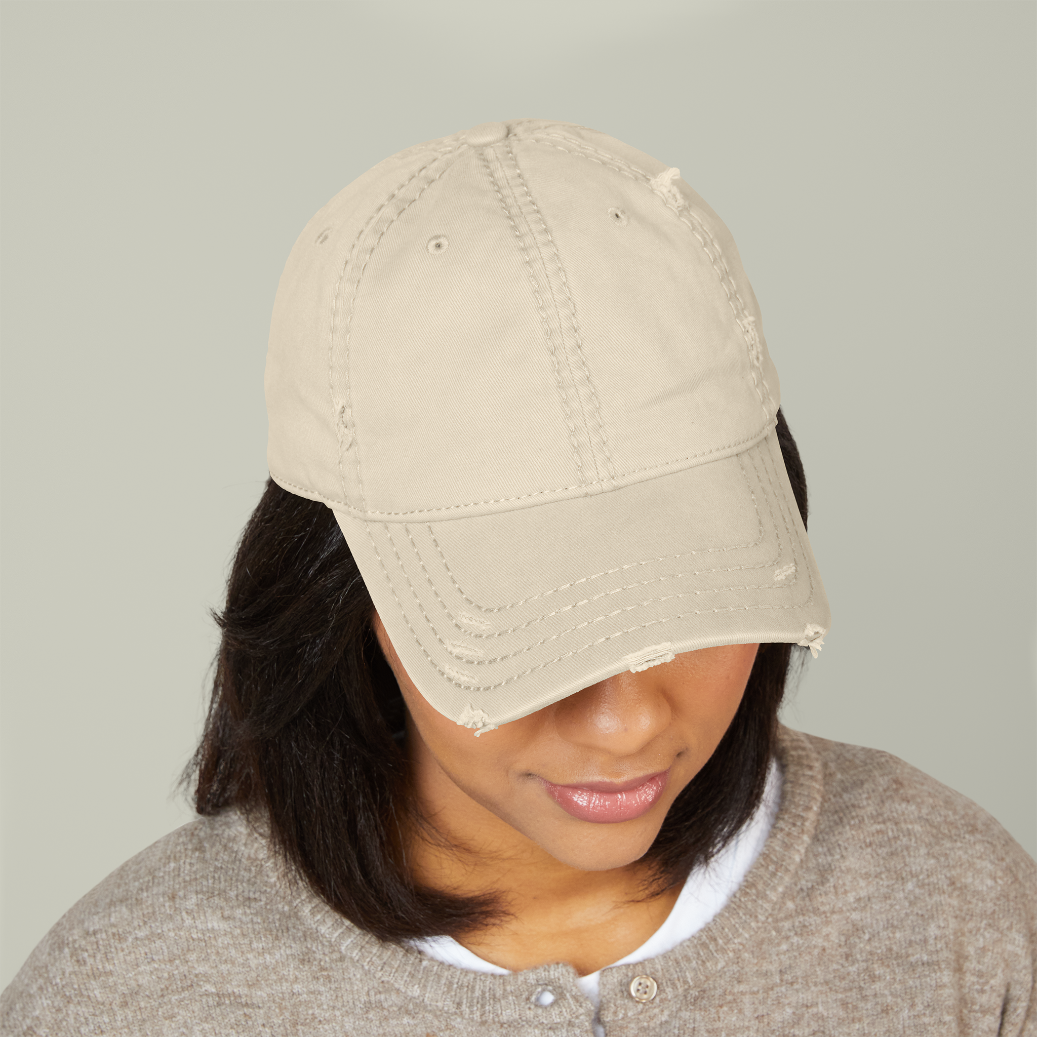 Custom embroidered cap with a lawn-care company logo